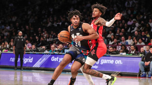 Nets guard Cam Thomas drives past Houston Rockets guard Jalen Green (4) in the second quarter at Barclays Center.